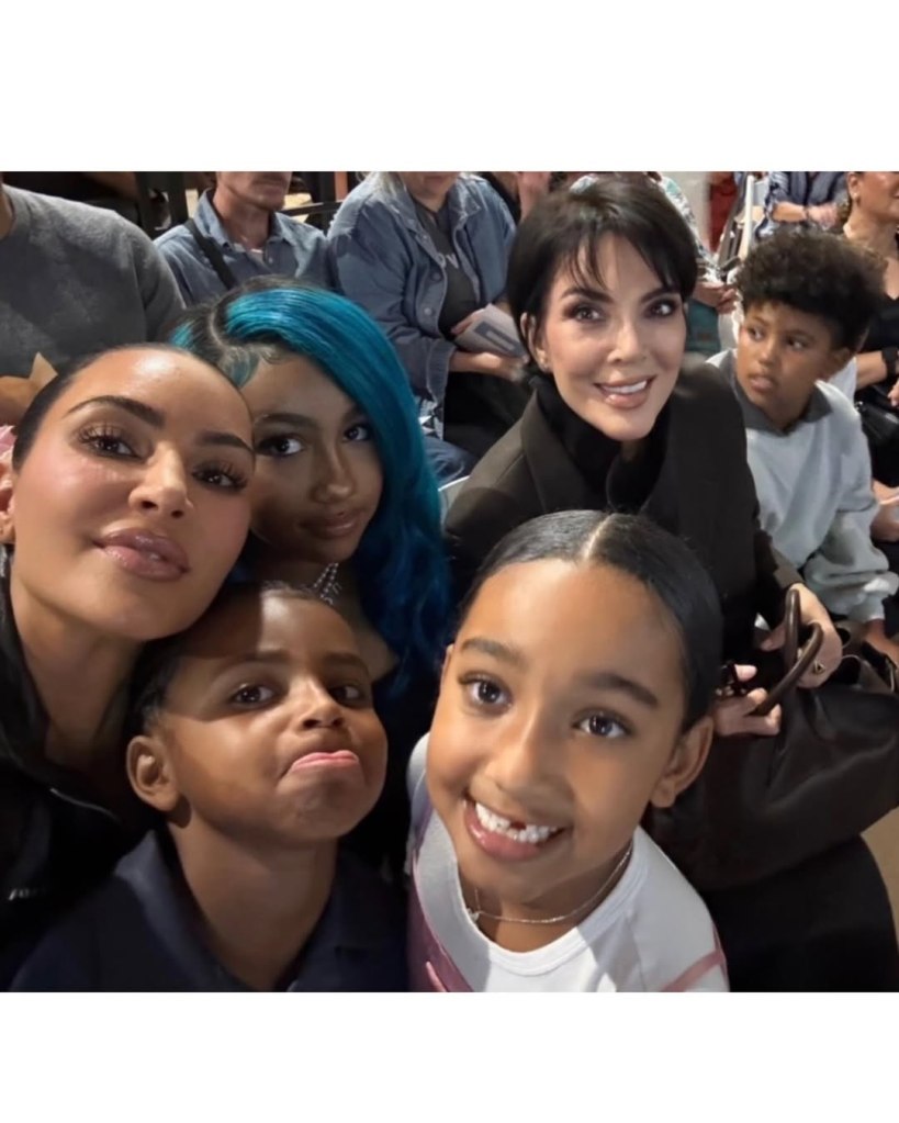 Kim Kardashian, Kris Jenner, and family members taking a selfie.