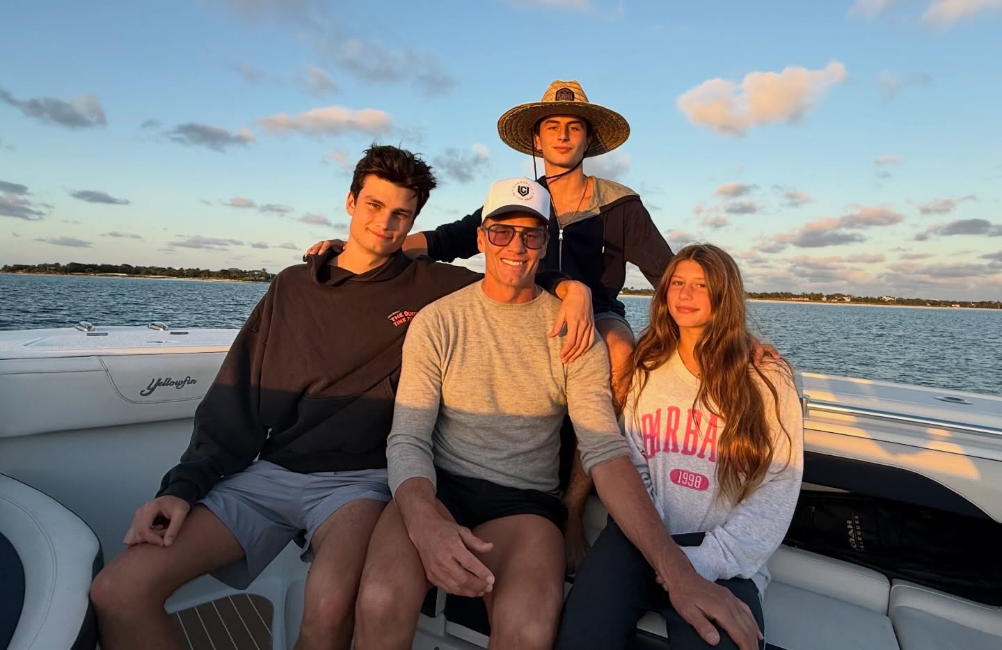 Tom Brady and his three children on a boat.