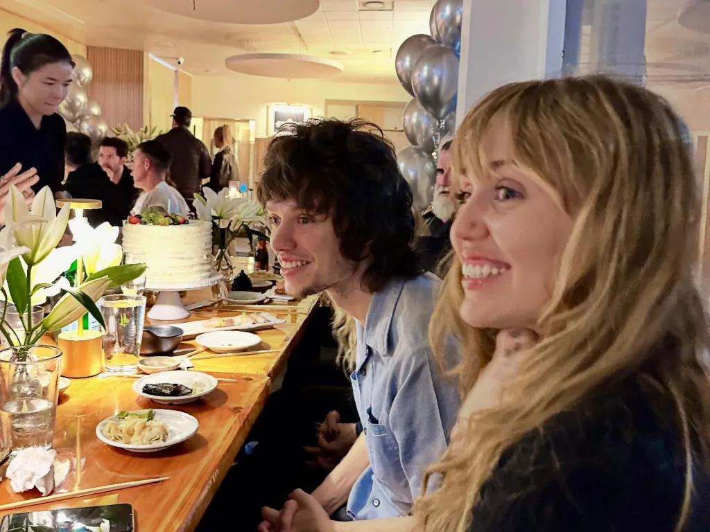 Maxx Morando and Miley Cyrus at dinner.