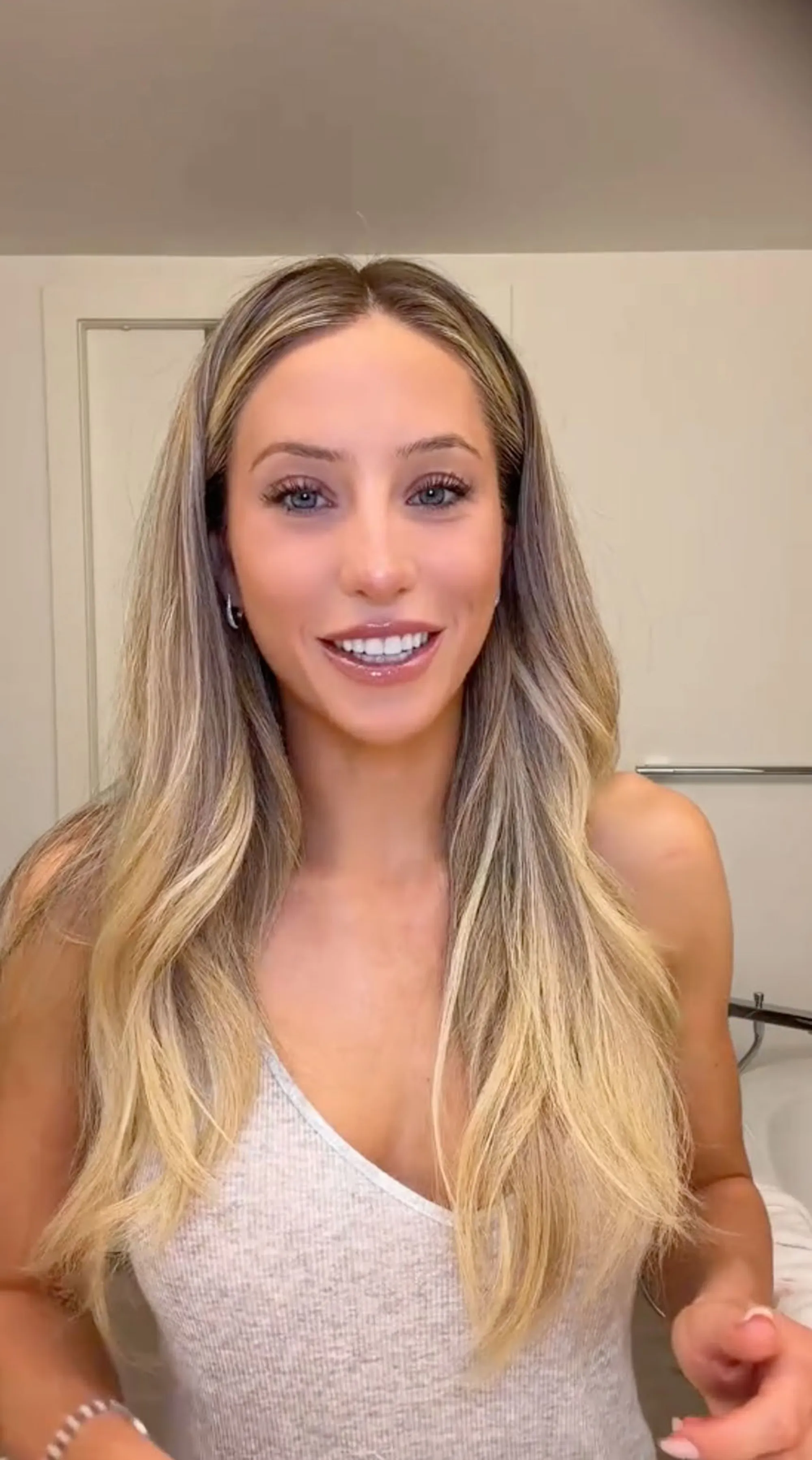 Alix Earle smiling at the camera.