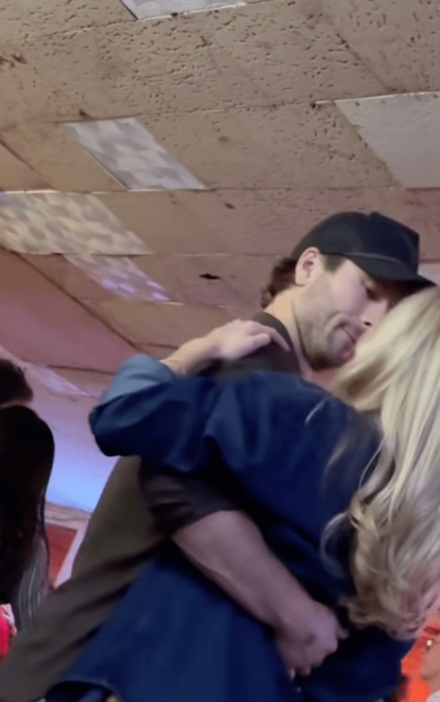 Glen Powell embracing Michelle Randolph while dancing.