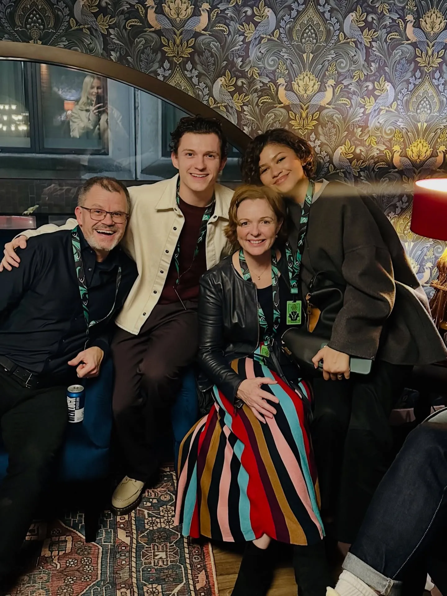 Zendaya and Tom Holland posing with Tom Holland's parents.