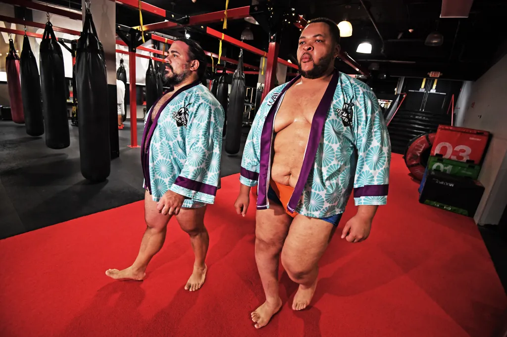 Ortiz and Kofi walk into the MMA studio.