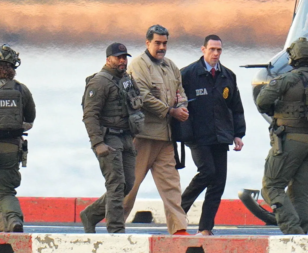 Nicolás Maduro, in handcuffs, being escorted by DEA agents.