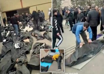 Gut-wrenching footage shows grieving families in Iran wailing and desperately searching through rows of dead bodies for loved ones
