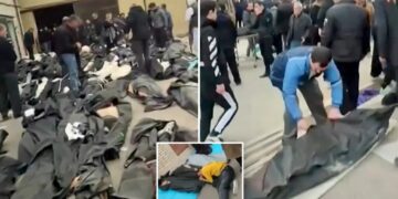 Gut-wrenching footage shows grieving families in Iran wailing and desperately searching through rows of dead bodies for loved ones