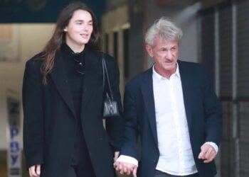 Sean Penn, 65, and much-younger girlfriend, 30, hold hands on rare public outing after Golden Globes