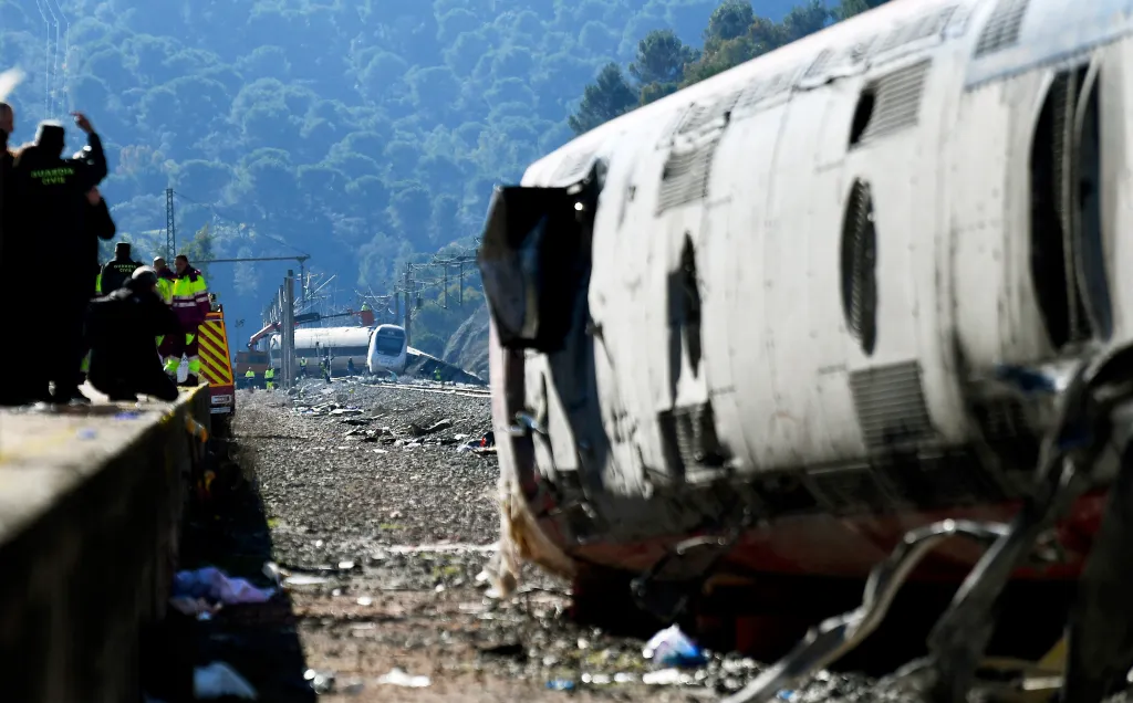 Derailment of a high-speed Iryo train with emergency responders at the accident site.