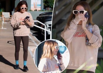 See photos of Ashley Tisdale’s  somber phone conversation as ‘toxic’ mom group drama continues