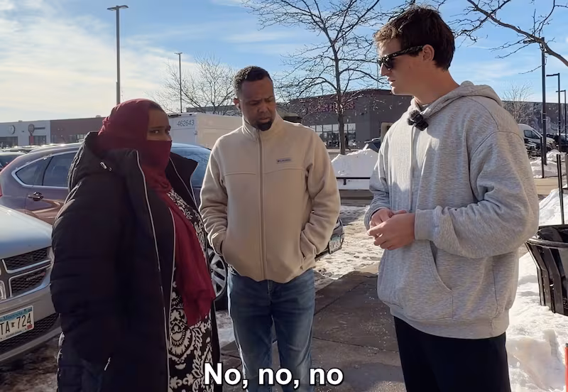 Shirley speaking to people outside a Minnesota day-care center.