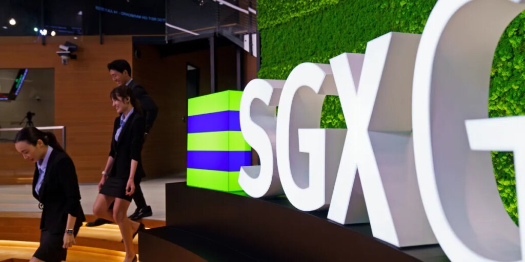 Singapore tries to give its flagging stock market a kickstart with a link to the NASDAQ, allowing firms to easily list in both places