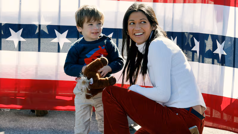 Katie Miller and her son at a Donald Trump campaign rally last year. She married the top Trump adviser Stephen Miller in 2020 with the president in attendance.