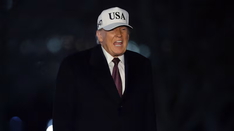 President Donald Trump walks on the South Lawn after he landed at the White House on January 11, 2026 in Washington, DC.