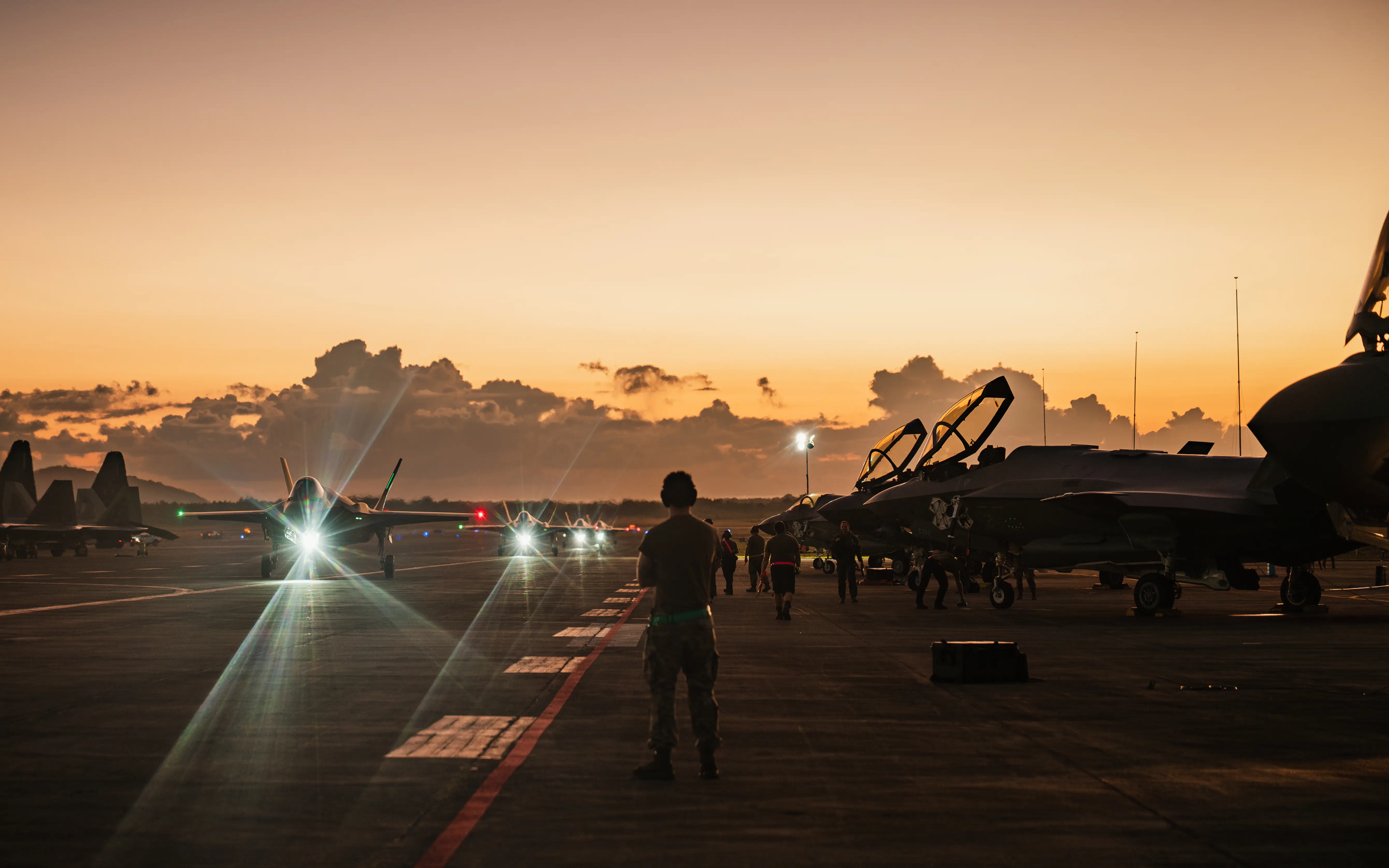 US Air Force crew chiefs watch as F-35A Lightning II's taxi following military actions in Venezuela in support of Operation Absolute Resolve, Jan. 3, 2026.