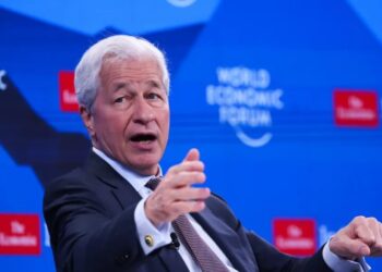 How leaders like Jamie Dimon and Microsoft president Brad Smith are trying to ease employee anxiety about AI