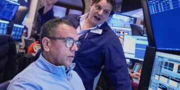 Wall Street flirts with record high as GM, UnitedHealth report earnings