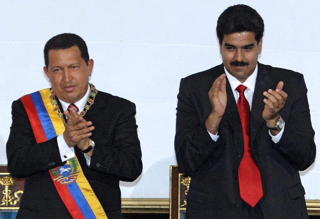 Venezuelan President Hugo Chavez and Foreign Minister Nicolas Maduro applauding at a session of the Venezuelan Congress.