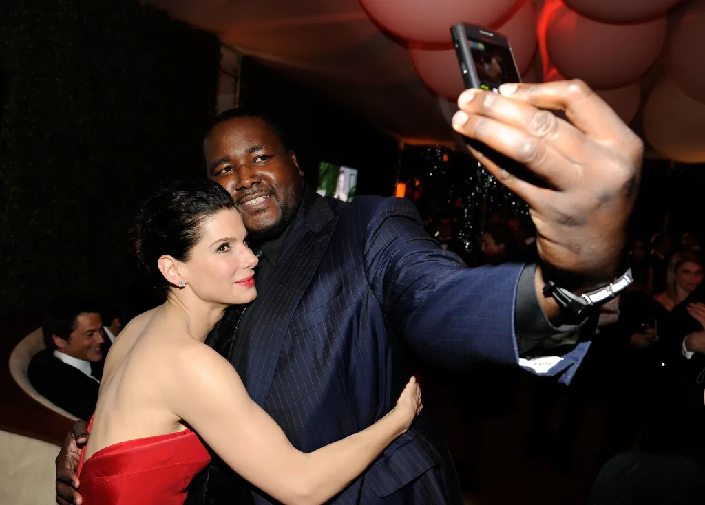 Sandra Bullock and Quinton Aaron attends the 2011 Vanity Fair Oscar Party Hosted by Graydon Carter at the Sunset Tower Hotel on February 27, 2011 in West Hollywood, California. 