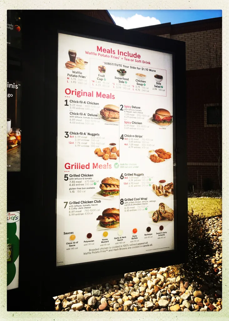 Chick-fil-A menu board in drive-thru of the McKnight Road restaurant.