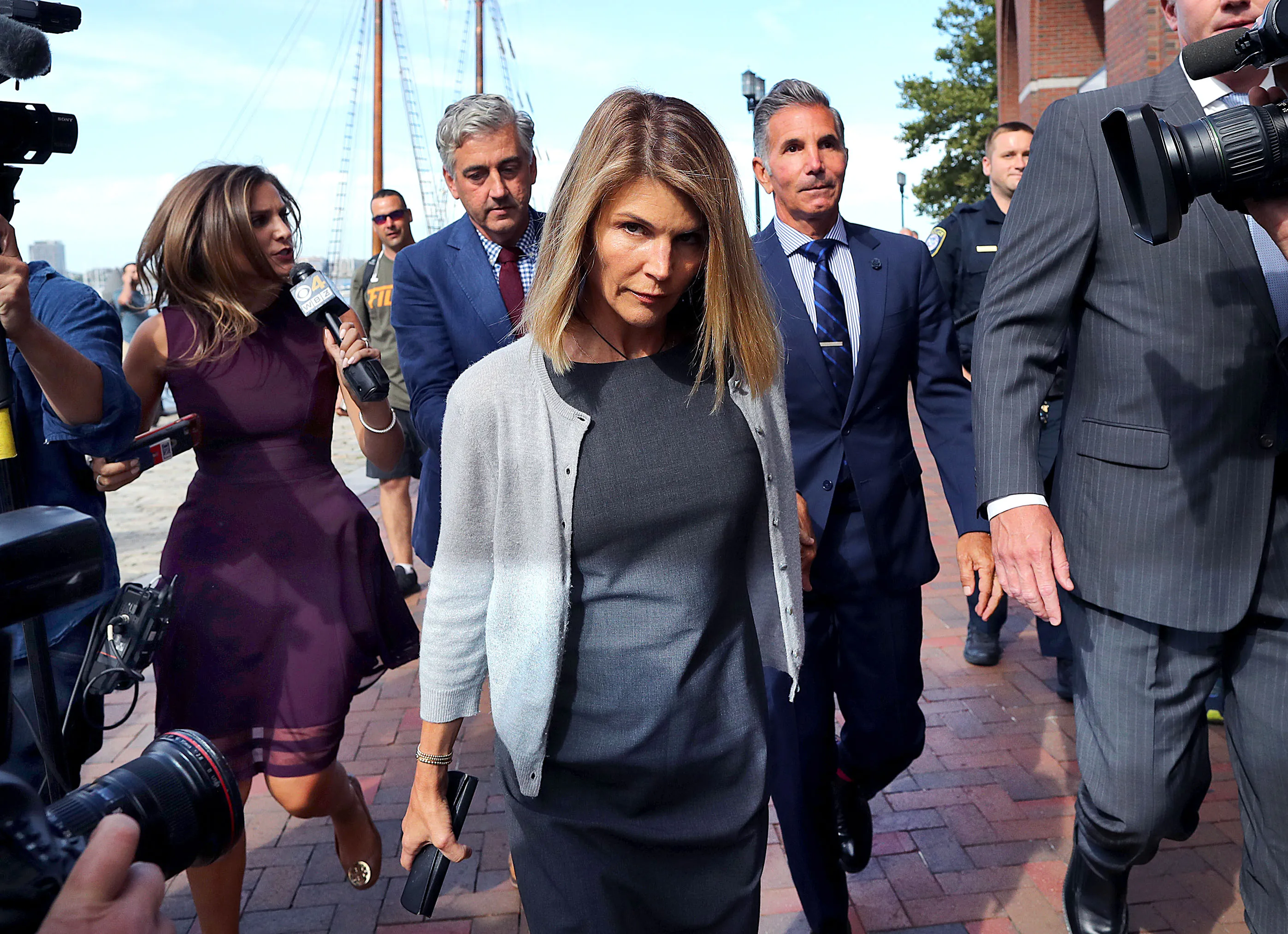 Lori Loughlin leaving the John Joseph Moakley United States Courthouse in Boston with her husband, Mossimo Giannulli.
