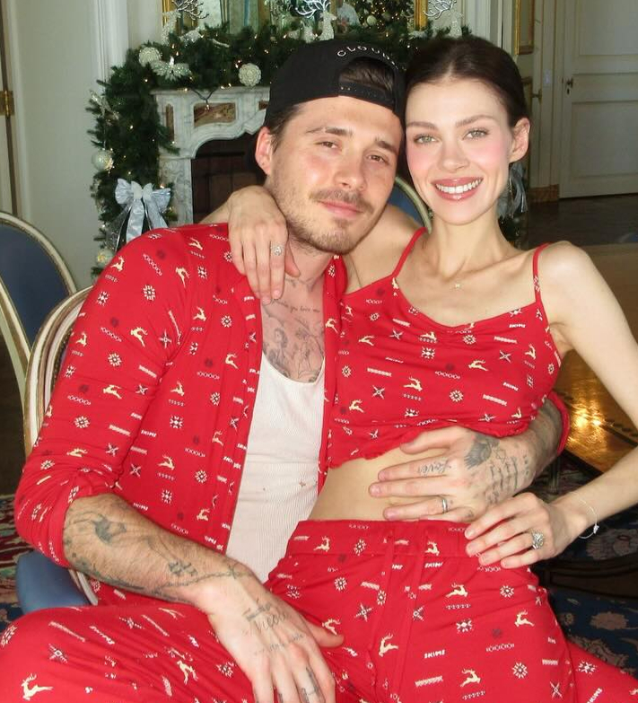 Brooklyn Peltz Beckham and Nicola Peltz in matching red festive pajamas.