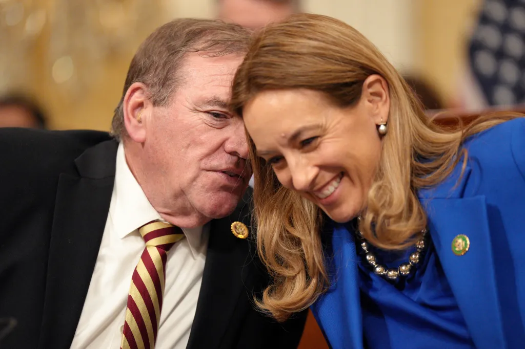 Rep. Neal Dunn speaks with Rep. Mikie Sherrill before a House Select Committee on the Chinese Communist Party hearing on Feb. 28, 2023.
