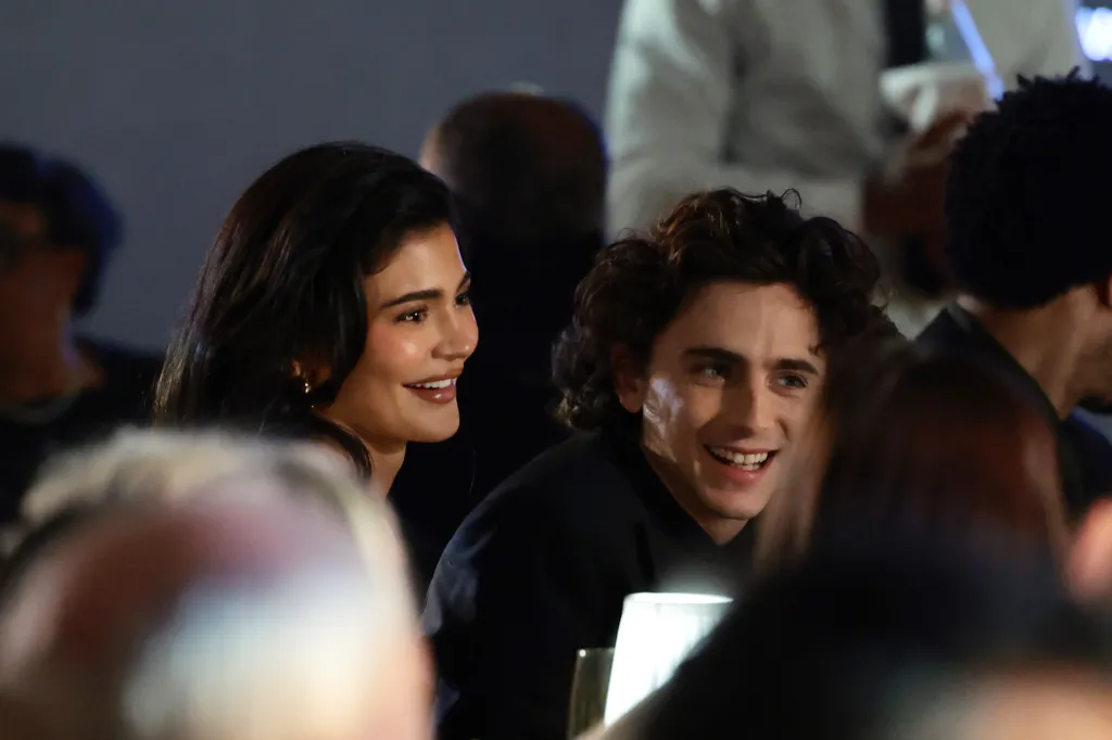 Kylie Jenner and Timothée Chalamet smiling.