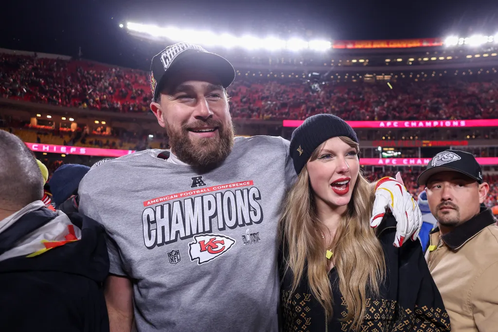 Taylor Swift celebrating with Travis Kelce, who wears a Chiefs AFC Champions shirt, after the AFC Championship game.