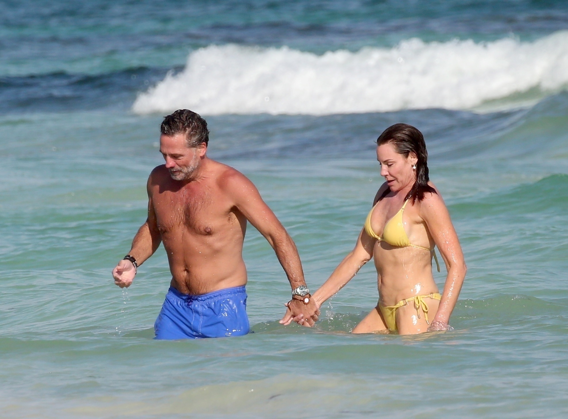 Luann De Lesseps and Michael Riemerschmid holding hands in the Caribbean Sea.