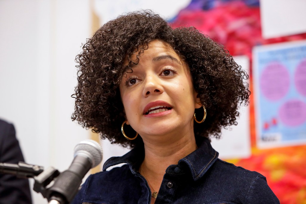 Catherine Almonte Da Costa speaking at a press conference.