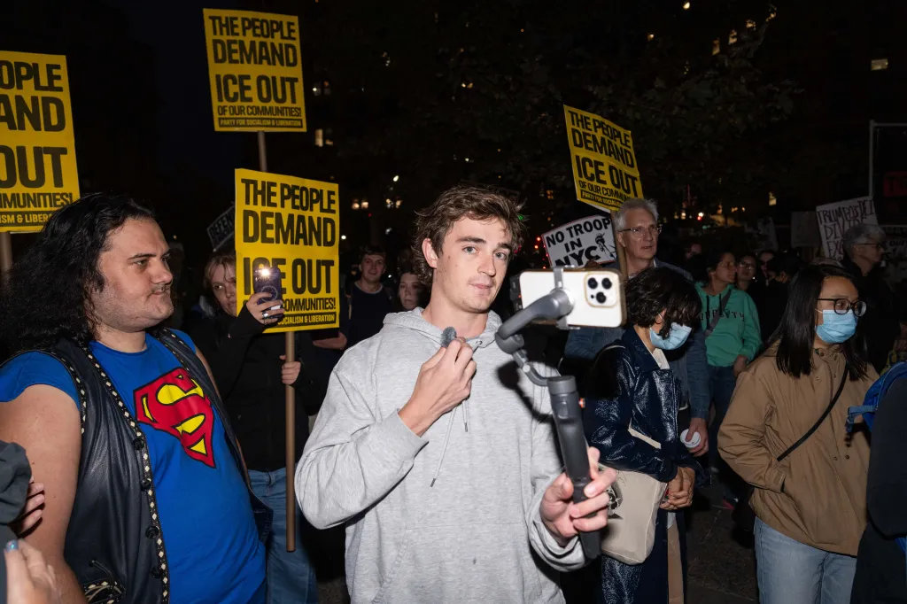 Nick Shirley films protestors demonstrating against US Immigration and Customs Enforcement (ICE) arrests on October 22, 2025 in New York City.