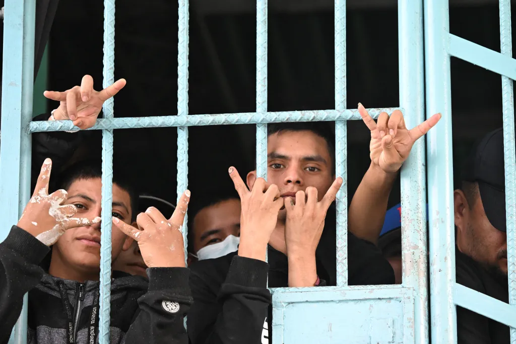 Mara Salvatrucha gang members make a gang sign during a raid in Pavoncito Prison in Fraijanes, Guatemala.