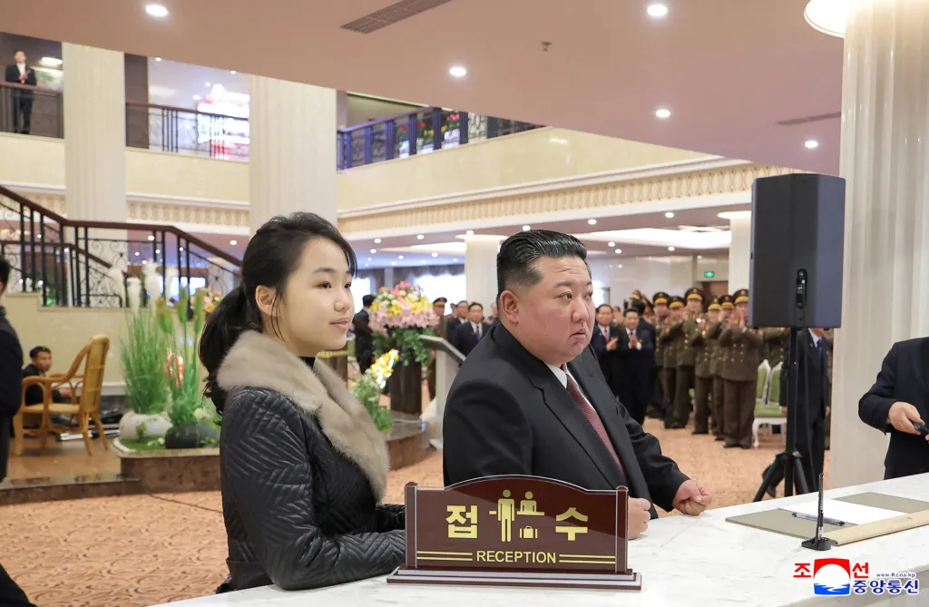 North Korean leader Kim Jong Un and his daughter Kim Ju Ae stand at a hotel reception counter as they attend an inauguration ceremony for hotels in the tourist resort in Samjiyon City, North Korea, December 20, 2025.