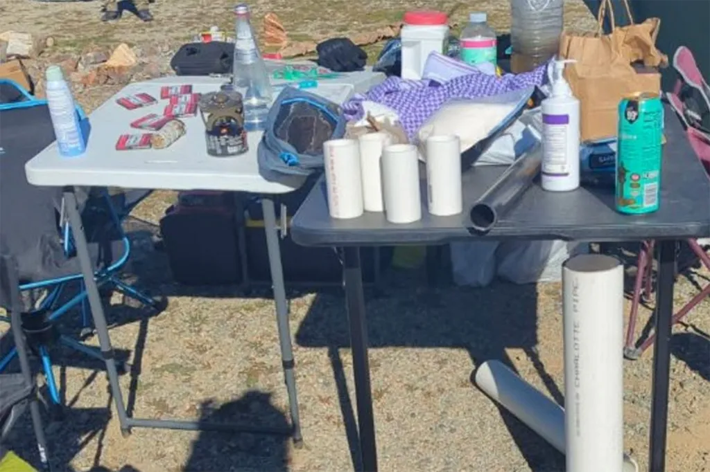 Items on two folding tables that include pipe bomb components.