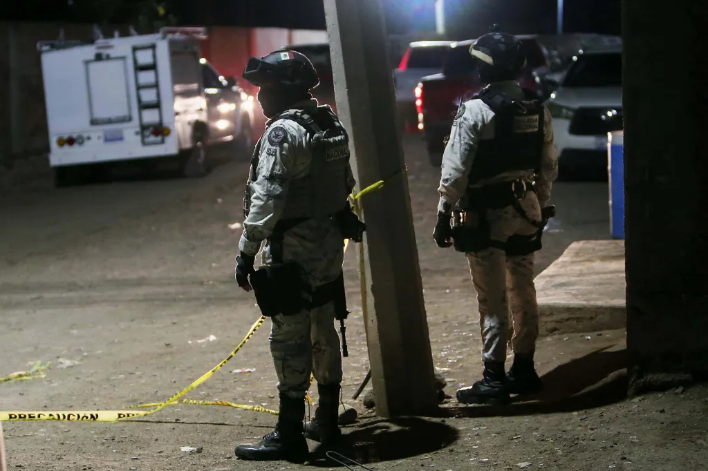 National Guard members stand at the crime scene in Salamanca, Guanajuato state, Mexico.