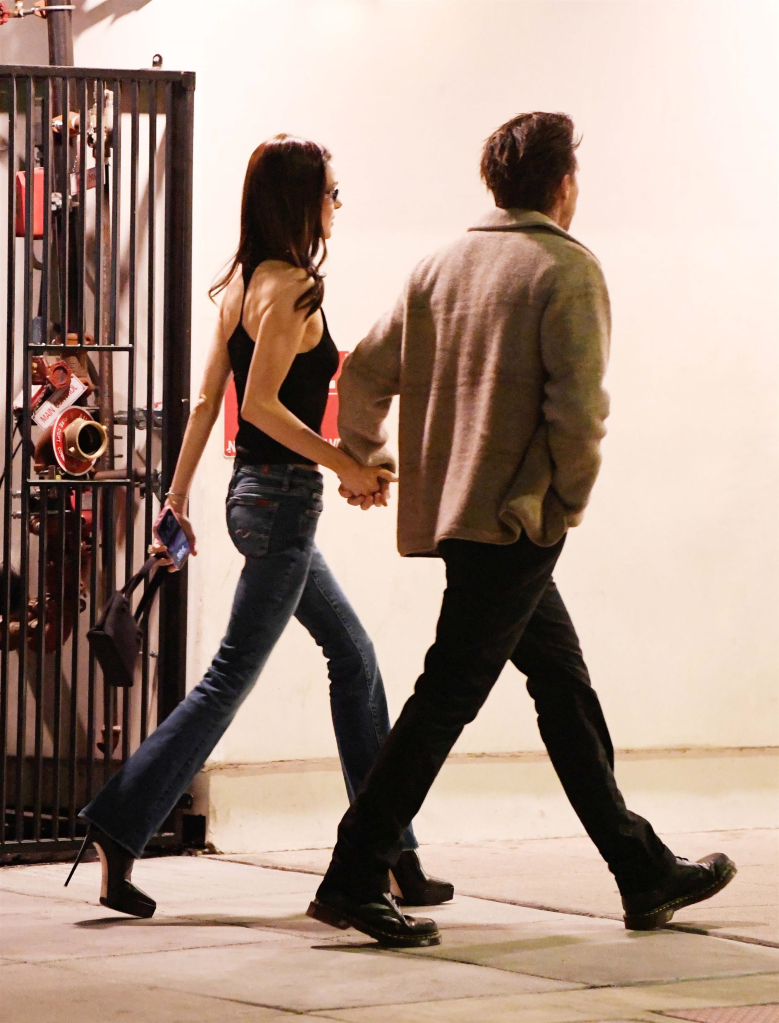 Brooklyn Beckham and Nicola Peltz holding hands while walking to Matsuhisa in Los Angeles.