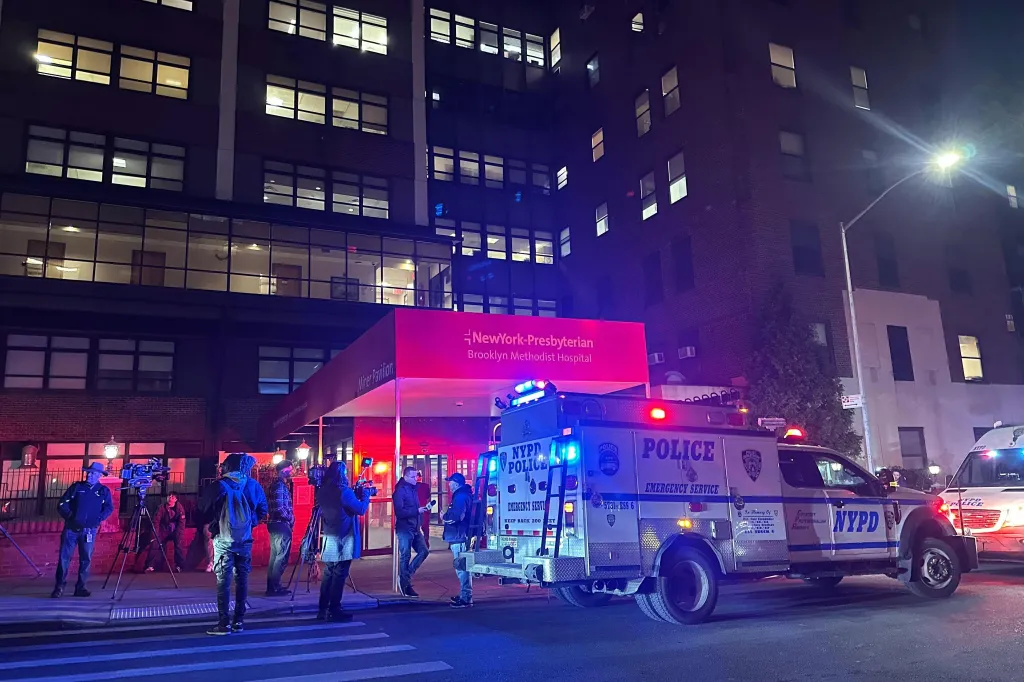 Police vehicles and media personnel outside NewYork-Presbyterian Brooklyn Methodist Hospital after an officer-involved shooting.