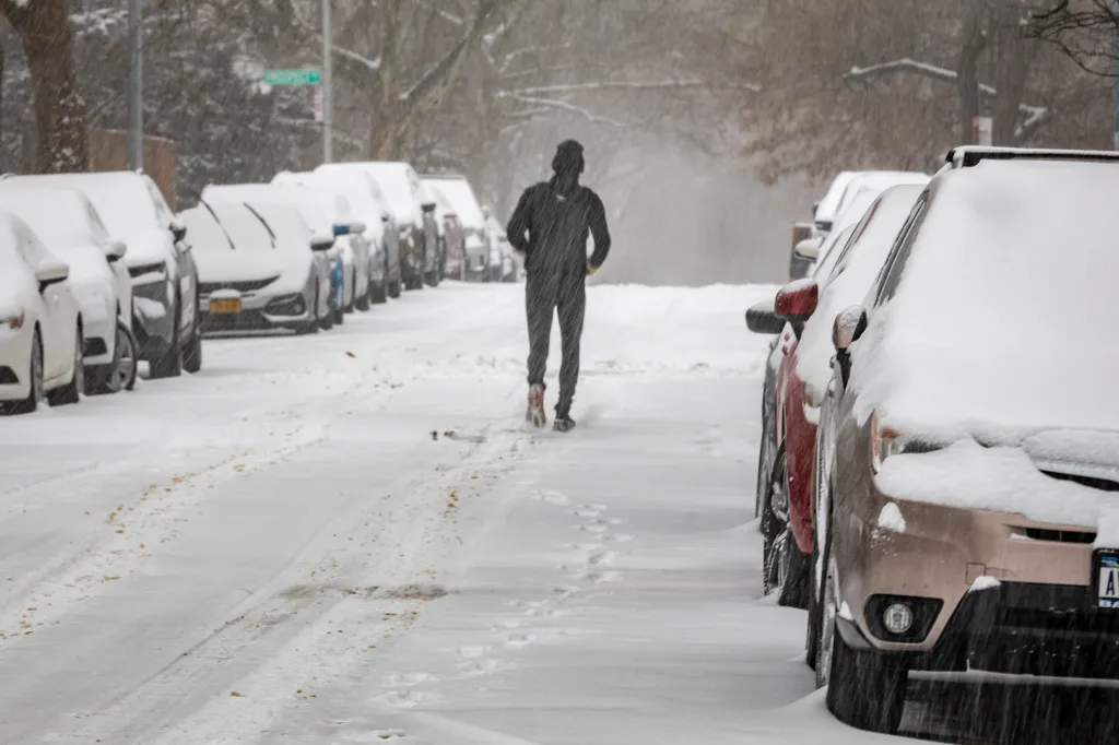A New Yorker jogging in Brooklyn during the blizzard.