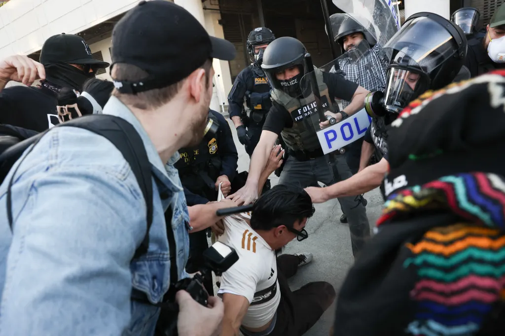 Protestors clashing with police during an immigration protest.