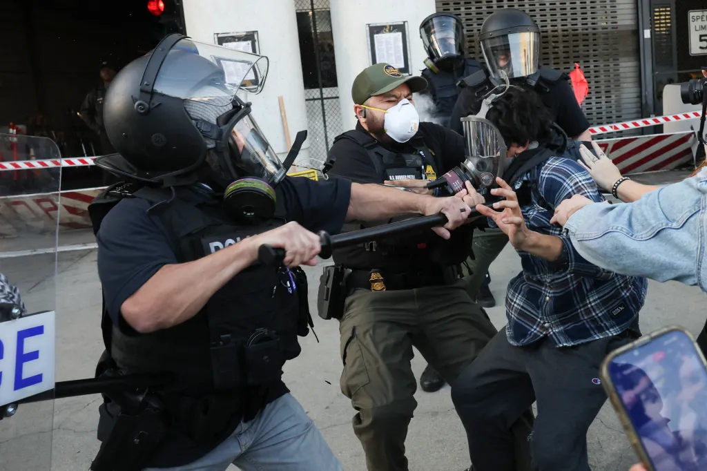 Police clash with protestors during a