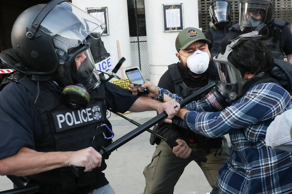 Protesters clash with police during an anti-ICE demonstration.
