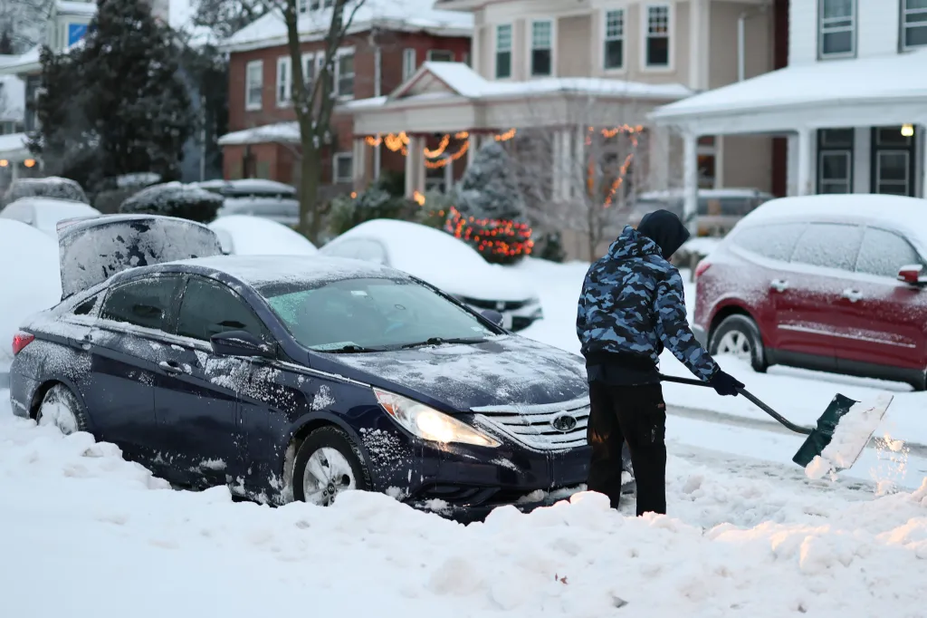 Residents shovel out cars after a winter storm in Flatbush, Brooklyn on Jan. 26, 2026.