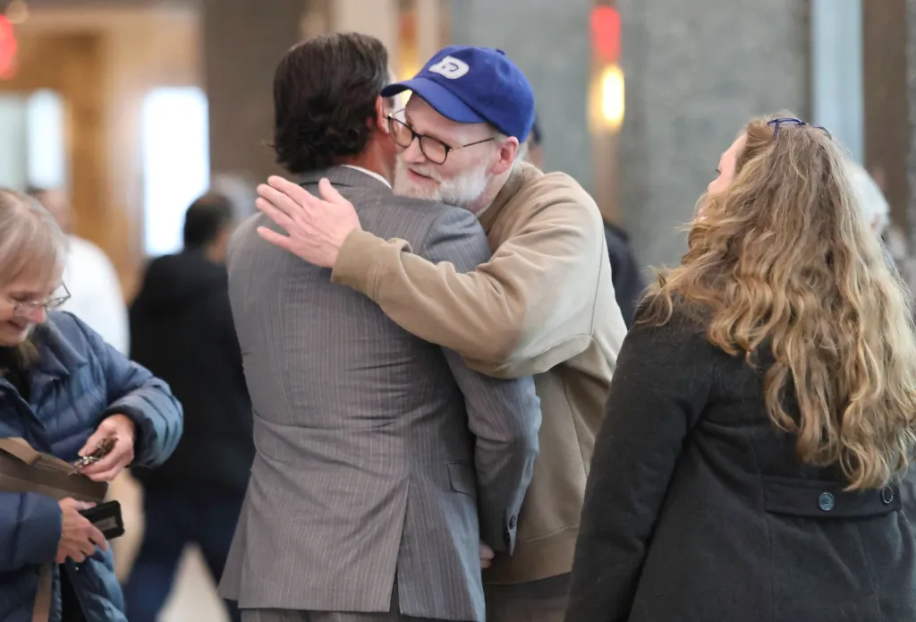Charles Foehner hugs attorney Thomas Kenniff after his sentencing on Jan. 14, 2026.