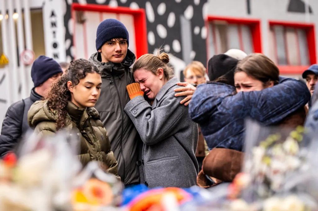 Mourners gather near the bar Le Constellation after the deadly fire in the Alpine ski resort town of Crans-Montana on Jan. 2, 2026.