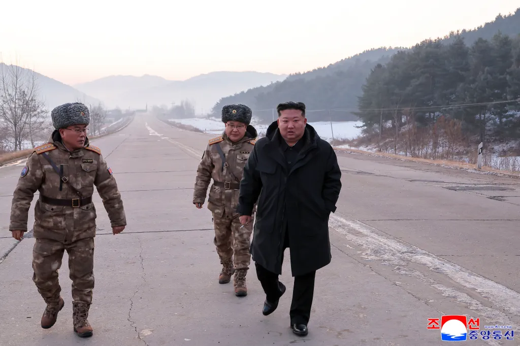 Kim Jong Un walks on a road as he inspects test-flights of hypersonic missiles, in Pyongyang, North Korea, Sunday, Jan. 4, 2026.