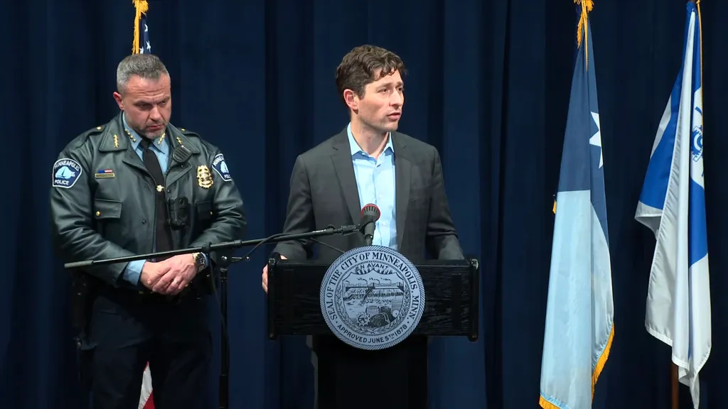 Minneapolis Mayor Jacob Frey and Police Chief Brian O'Hara speak at a press conference after a ICE agent-involved shooting on Jan. 14, 2026.