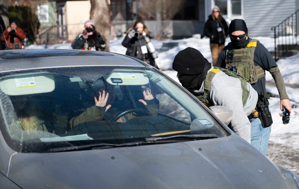 A US Border Patrol agent confronts a driver that was following them in Minneapolis, Minnesota, on Jan. 29, 2026.