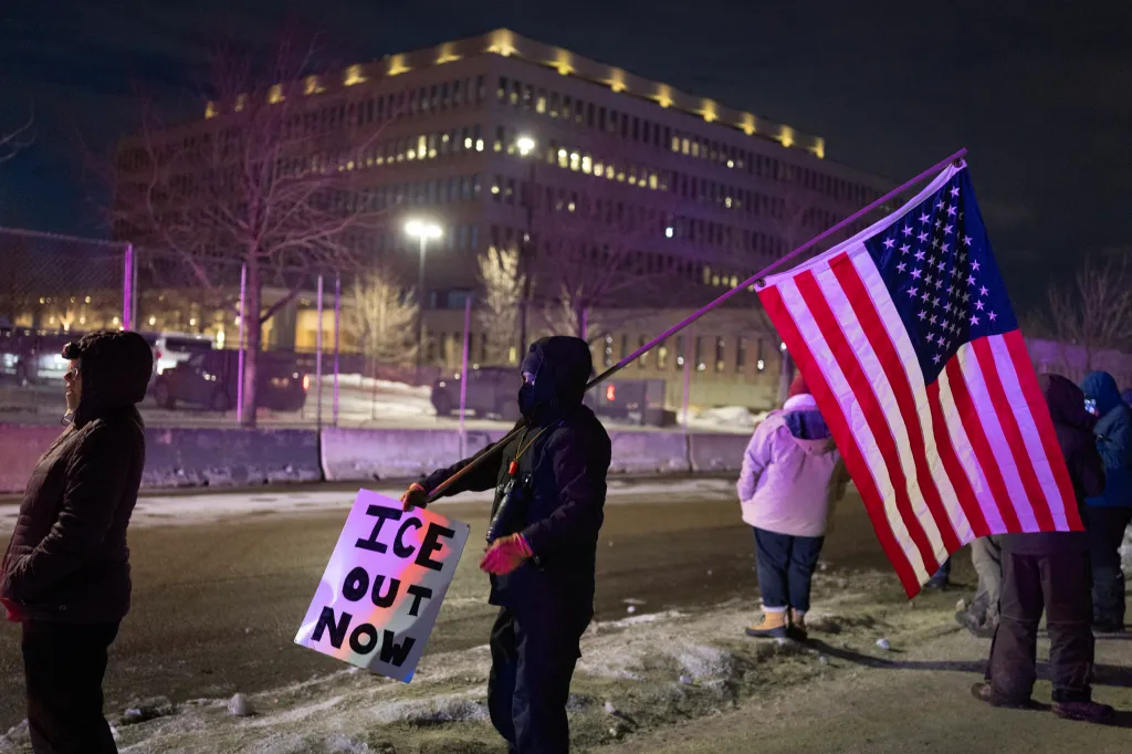 An anti-ICE protester holds an American Flag in Minneapolis, Minnesota, on Jan. 17, 2026.