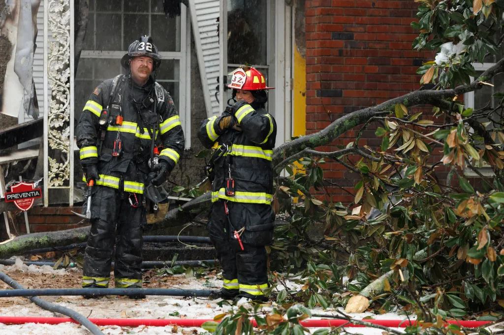 Nashville firefighters responding to a house fire during the storm.