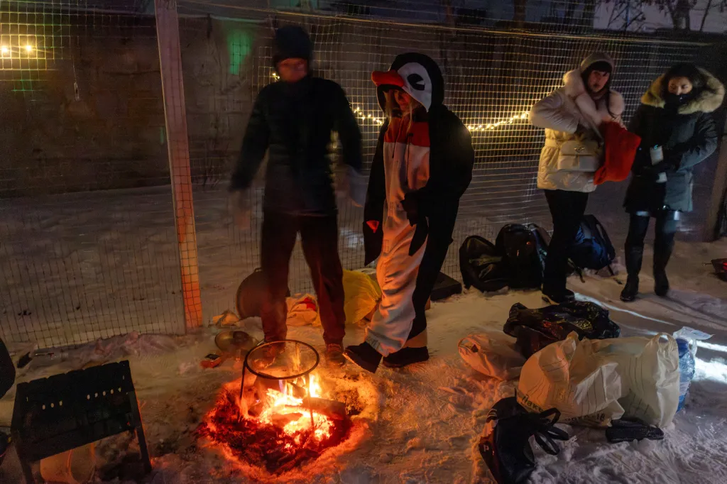 People dance around a bonfire at a blackout party in Kyiv.